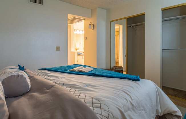 Foothills bedroom with bathroom and carpet flooring