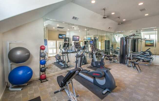 This is a photo of the 24-hour fitness center at The Brownstones Townhome Apartments in Dallas, TX.