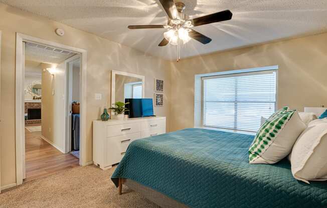 Bedroom With Ceiling Fan at Indian Creek Apartments, Carrollton
