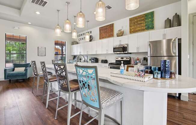 A kitchen with a table and chairs and a sign that says "COMPUTER CENTER".
