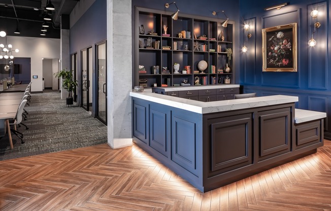 a view of the reception area with blue walls and wood flooring