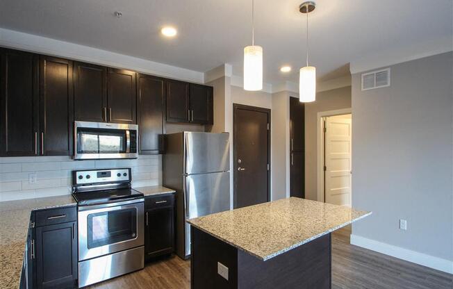 Modern Kitchens w/ Center Island for Bar Top Seating at The Edison at Avonlea, Minnesota