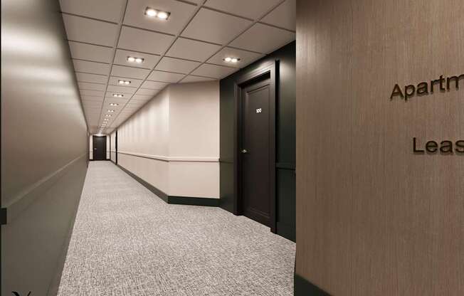A long hallway with a sign that says Apartment Lease.