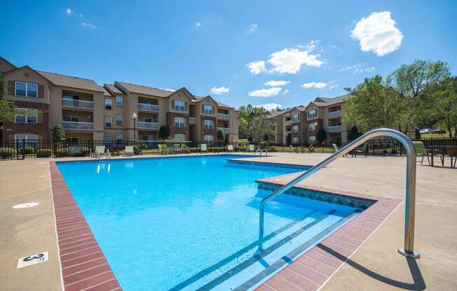 Swimming pool with the apartment complex in the background