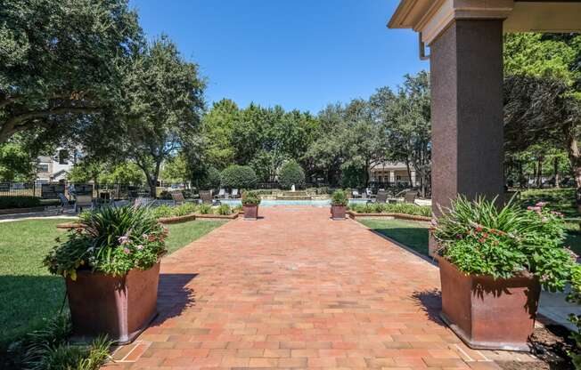 resort-inspired pathway to the swimming pool at Stoneleigh on Spring Creek apartments