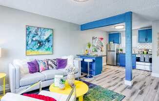Fusion Las Vegas living room with a white couch and a yellow coffee table.