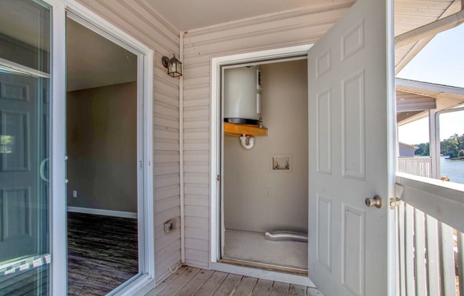 a view of a bathroom from a porch with a door