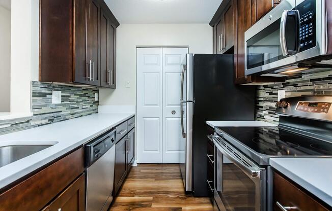 a kitchen with a stove top oven