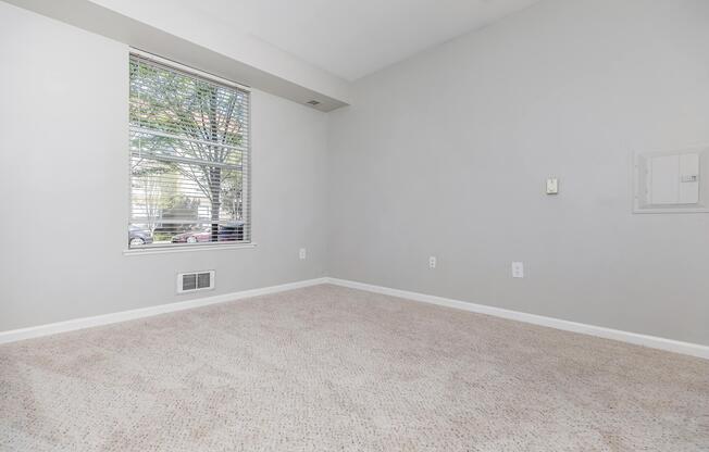 a bedroom with a large window