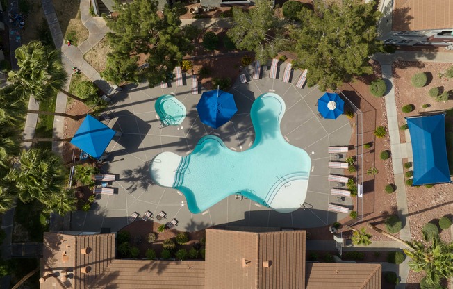 a birds eye view of a swimming pool in a park