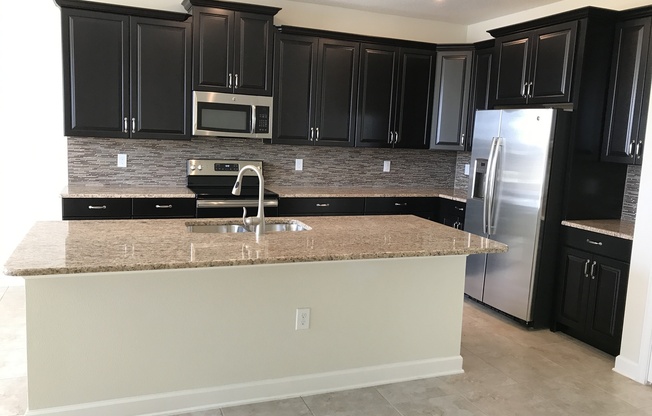 Large 4/3 Lake Front Executive Home with 3 Car Garage