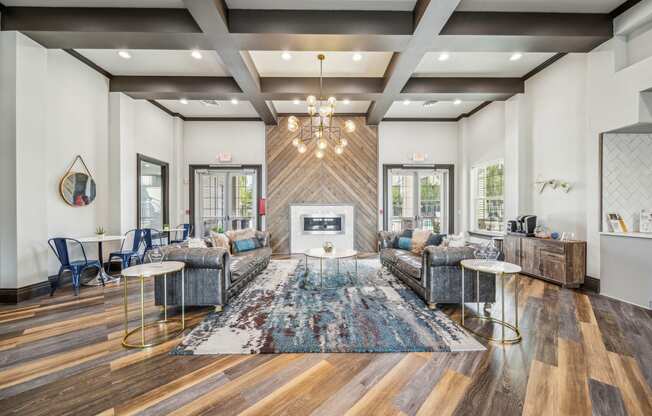 a living room with couches and chairs and a fireplace