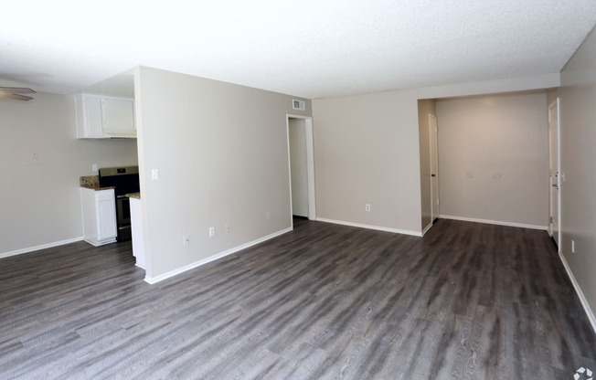 Living room with couch at Canyon Club Apartments, Upland, California, CA