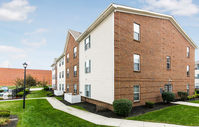 Admire the classic charm and modern design of this appealing apartment building.