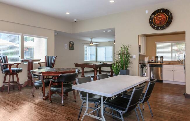 a living room filled with furniture and a large window