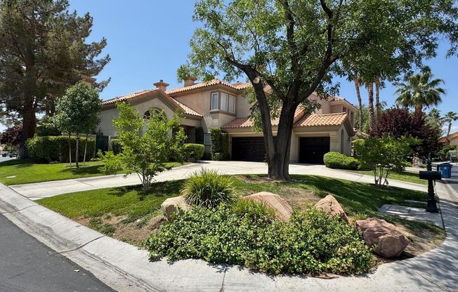 BEAUTIFUL TWO-STORY 4 BEDROOM 3 BATH HOME ON A CORNER LOT IN THE GUARD-GATED CANYON GATE COMMUNITY.