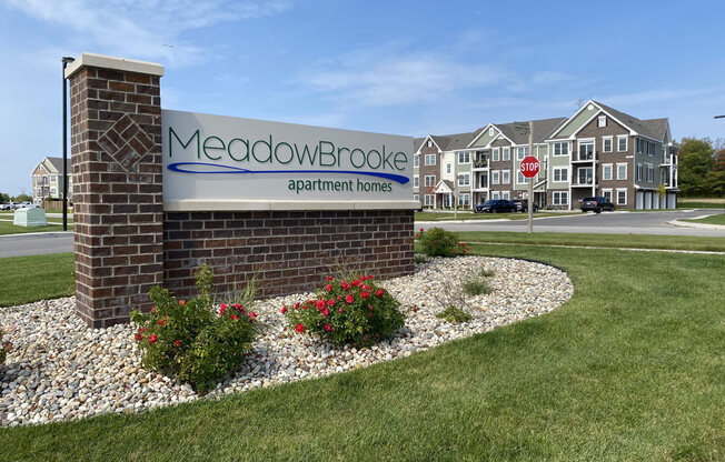 a sign in front of a building at Meadowbrooke Apartment Homes, Michigan, 49512