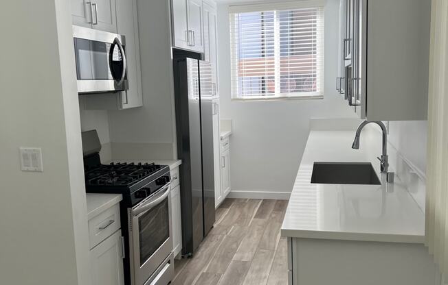 Kitchen with Stainless Steel Appliances and White Cabinets