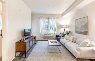 a living room with a couch and a coffee table