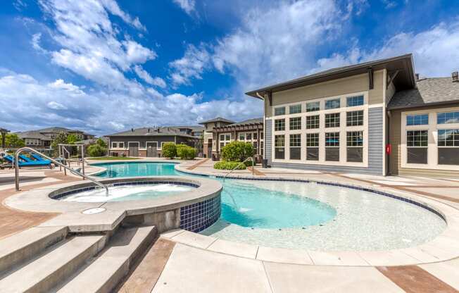 a swimming pool with a building in the background