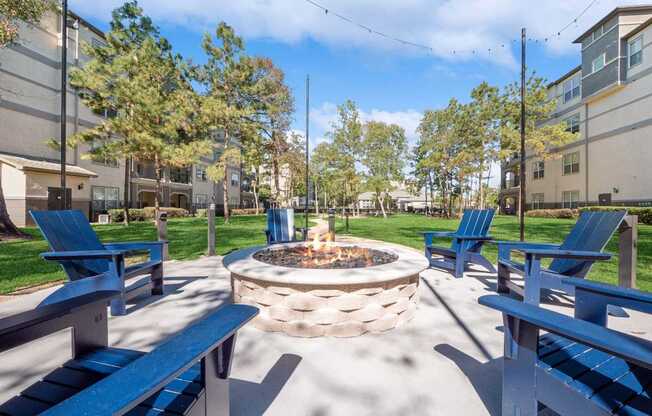 outdoor fireside lounging area at Berkshire Jones Forest apartments