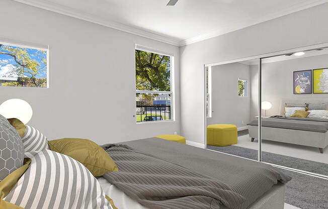 Carpeted bedroom with ceiling fan.