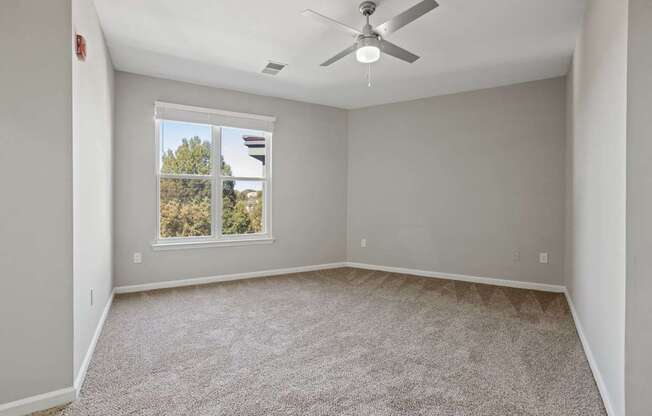 Flatiron West Trade Apartments gray carpeted bedroom