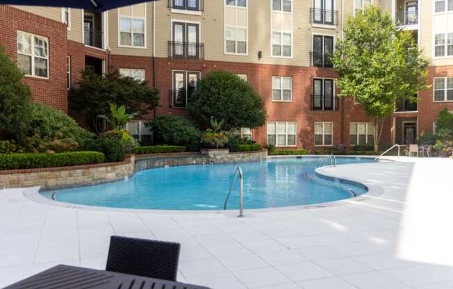 a swimming pool is shown in front of a fence