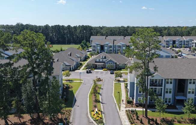 A view of a residential area with houses and trees.