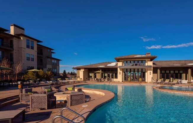 Resort Style Pool with Fire Tables and Lounge Chairs