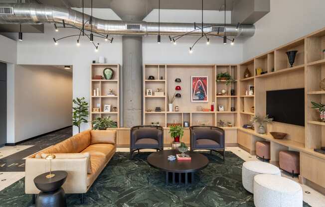 a living room with a couch and chairs and a table at The Draper, Missouri