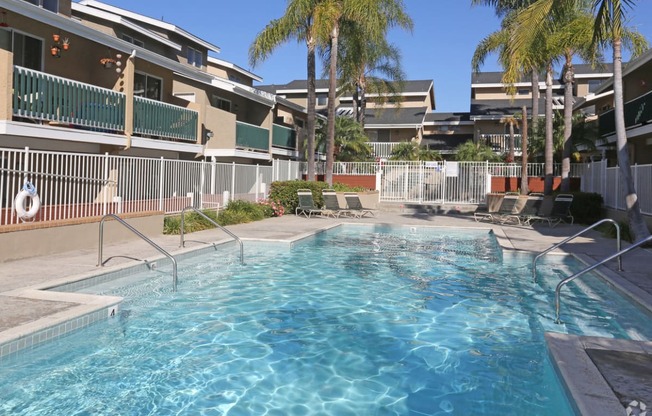 Pool-side view of the area with lounge chairs