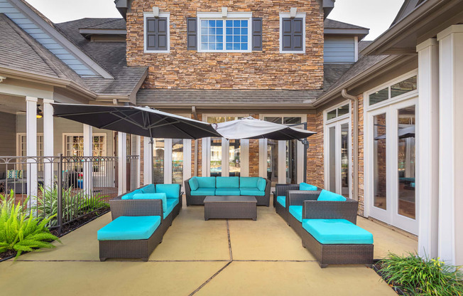 Lodge at Cypresswood Apartments - Poolside lounge