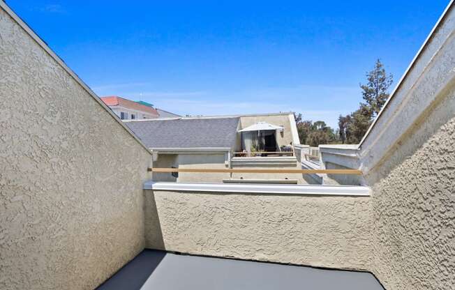 the view of the roof of a building from a balcony