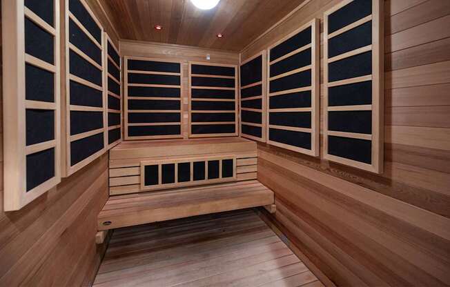 A sauna with wooden walls and benches.