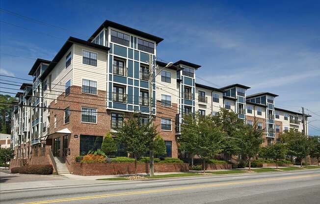 an apartment building on the corner of a street