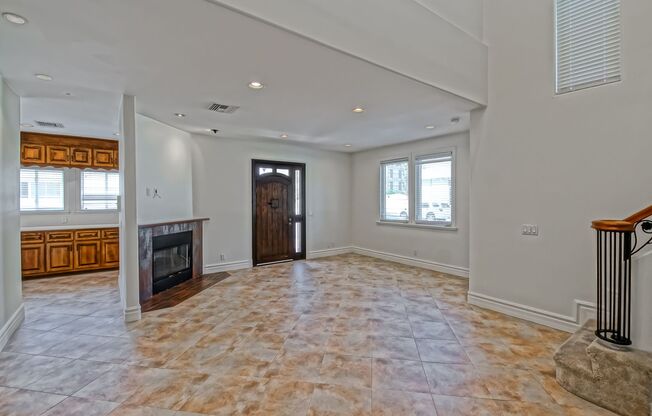SPACIOUS & BRIGHT, TWO-STORY HOME W/ FRONT YARD, BALCONY & 2-CAR GARAGE CLOSE TO SHOPPING, FREEWAY ACCESS, RB BORDER & MINS TO BEACH!