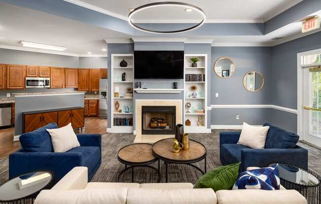 a living room with blue walls and a white fireplace