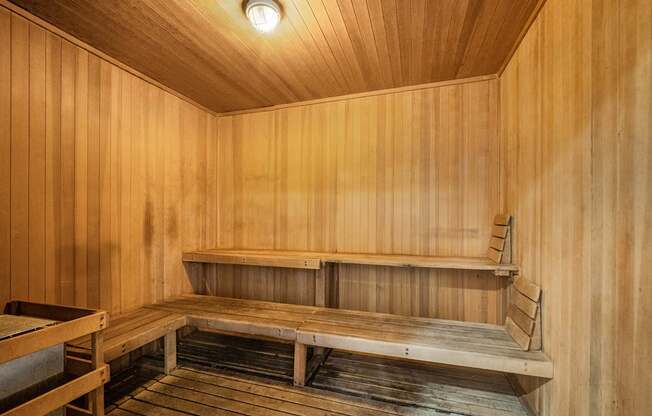 A wooden sauna with a bench and a light on the ceiling at Esprit Marina del Rey, 90292