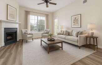 A living room with a fireplace, two chairs, a couch, a coffee table, and a ceiling fan.