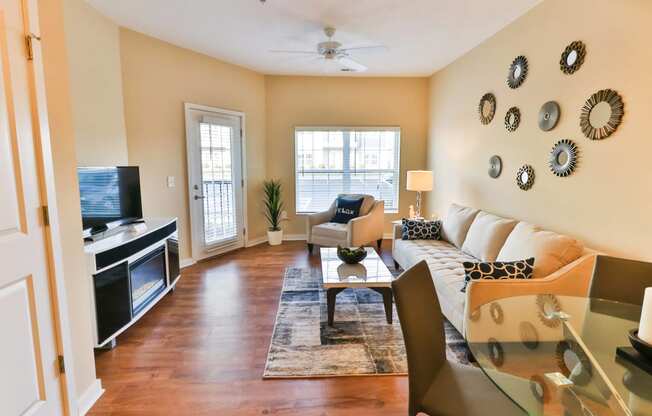 a living room with a couch and a table and a television