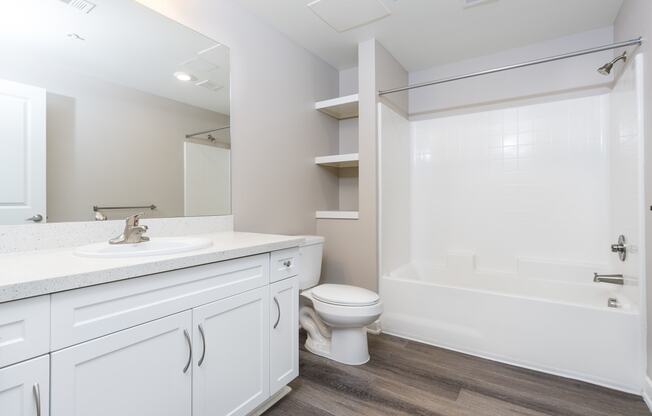 a bathroom with a toilet sink and bathtub