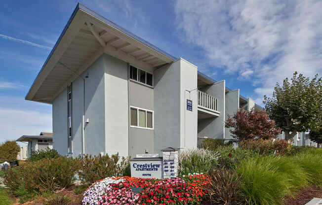 A modern building with a sign that says Crestview in front of it.