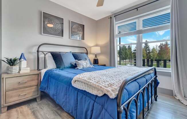 Bedroom With Expansive Windows at Latitude at South Portland Apartment, Maine, 04106