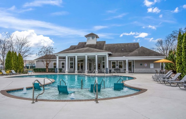 the swimming pool at the clubhouse at the estates apartments