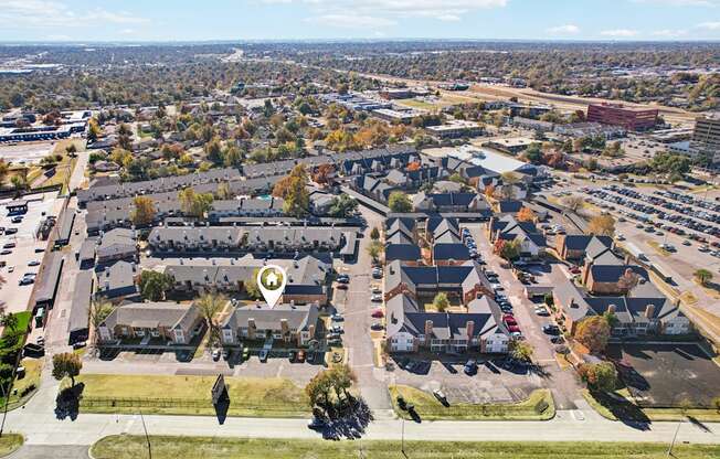 A bird's eye view of a residential area with a marker indicating a specific house.