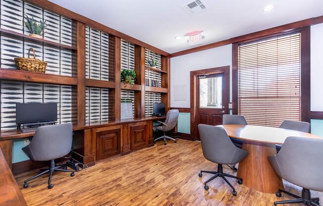 a living room filled with furniture and a large window