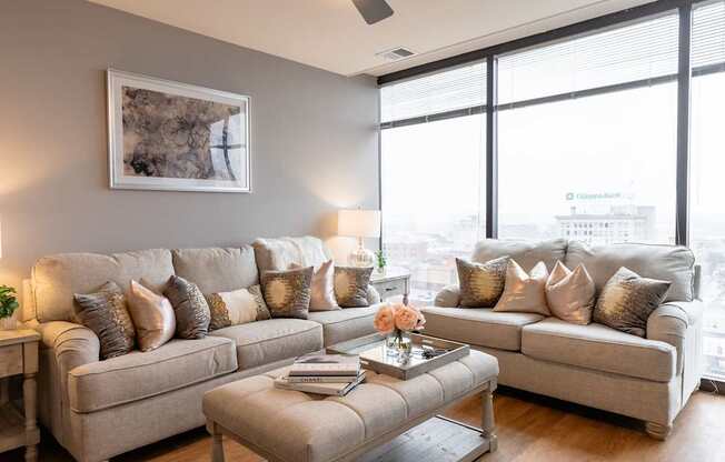 A living room with a large couch and a coffee table.