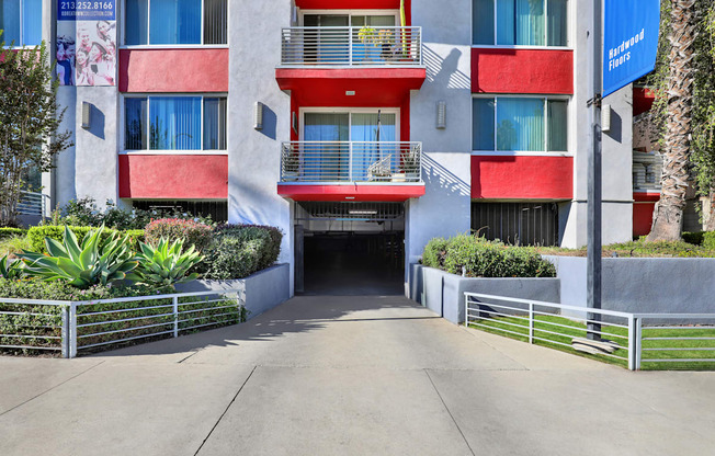 A red and white building with a blue banner on the right side.