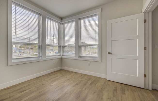 Empty bedroom space with windows